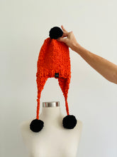 Load image into Gallery viewer, Handmade Aviator Hat | Orange with Black PomPoms
